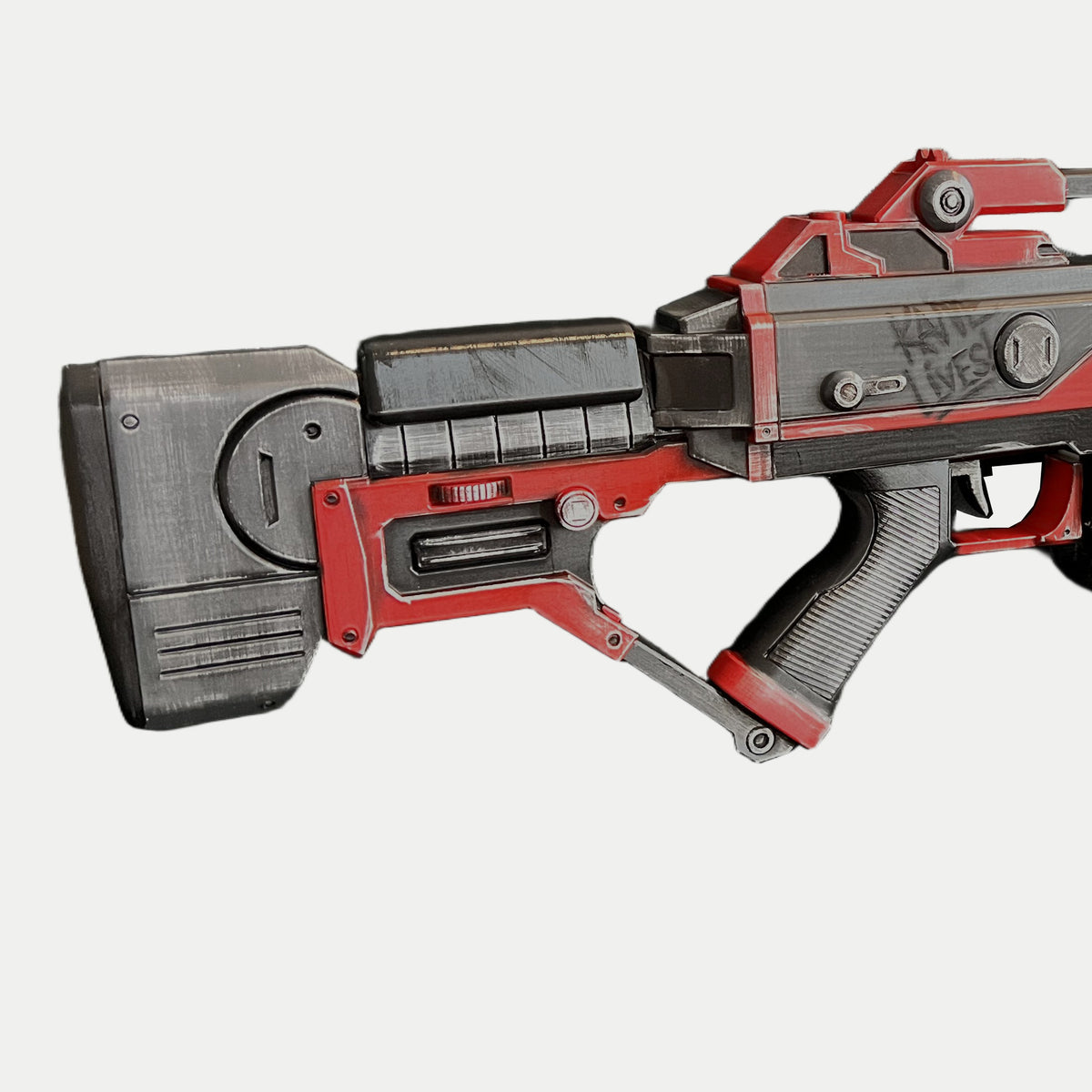 Close-up of the AR-70 Raptor Nod skeleton shoulder stock, with a gray buttplate, red frame, diagonal brace and silver-painted wear.