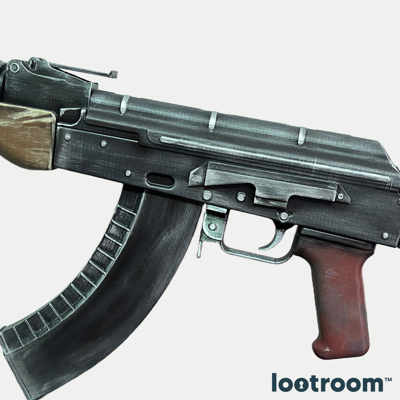 CS2 AK-47 default prop detail, oxblood grip and trigger below the gunmetal receiver