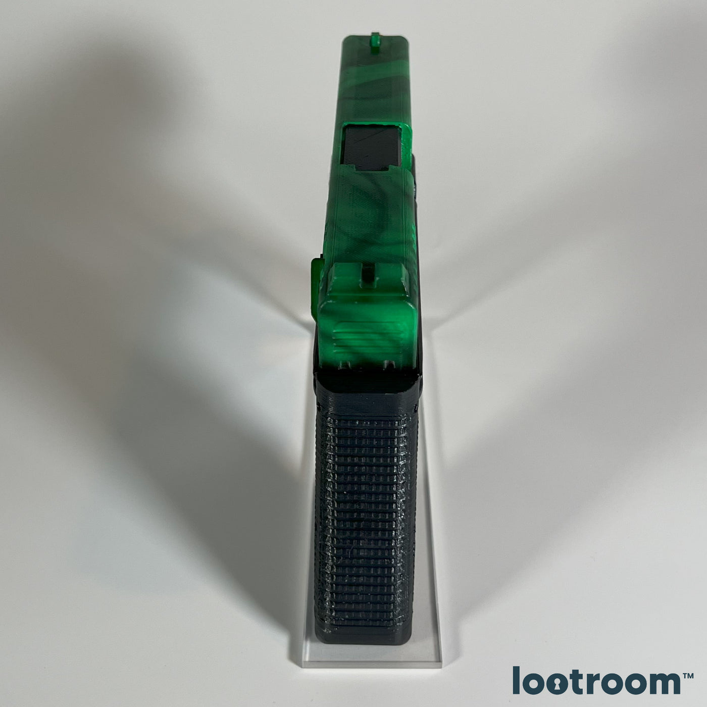 Top view of the CS2 Glock-18 Gamma Doppler Emerald prop, the dark veins swirling along the slide