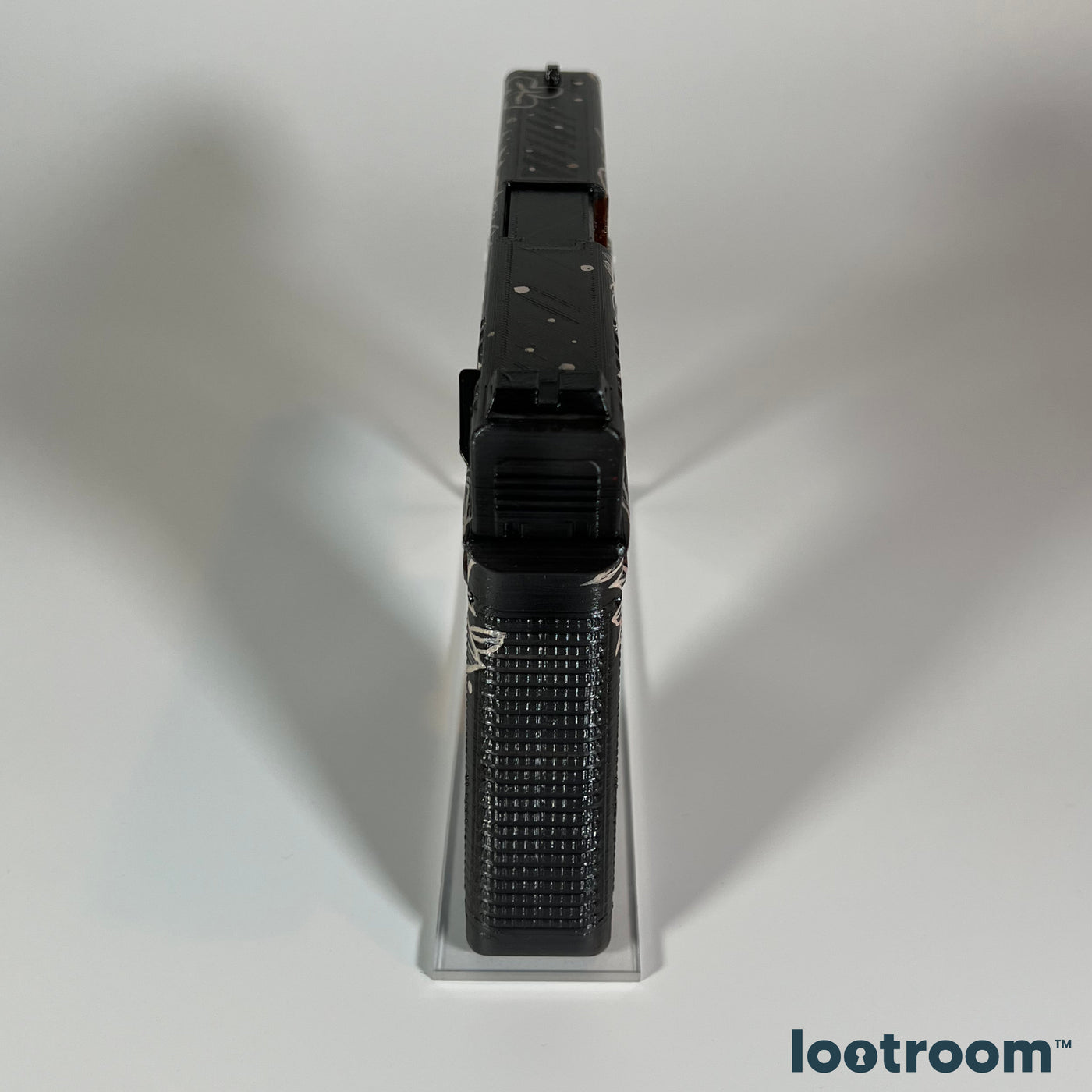 Top view of the CS2 Glock-18 Weasel prop, white dots scattered over the black slide
