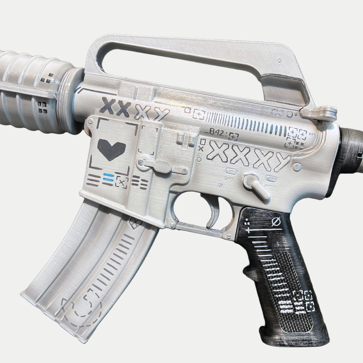 Receiver of the CS2 M4A1-S Printstream prop with the black heart, the XXXY lettering and the striped black grip