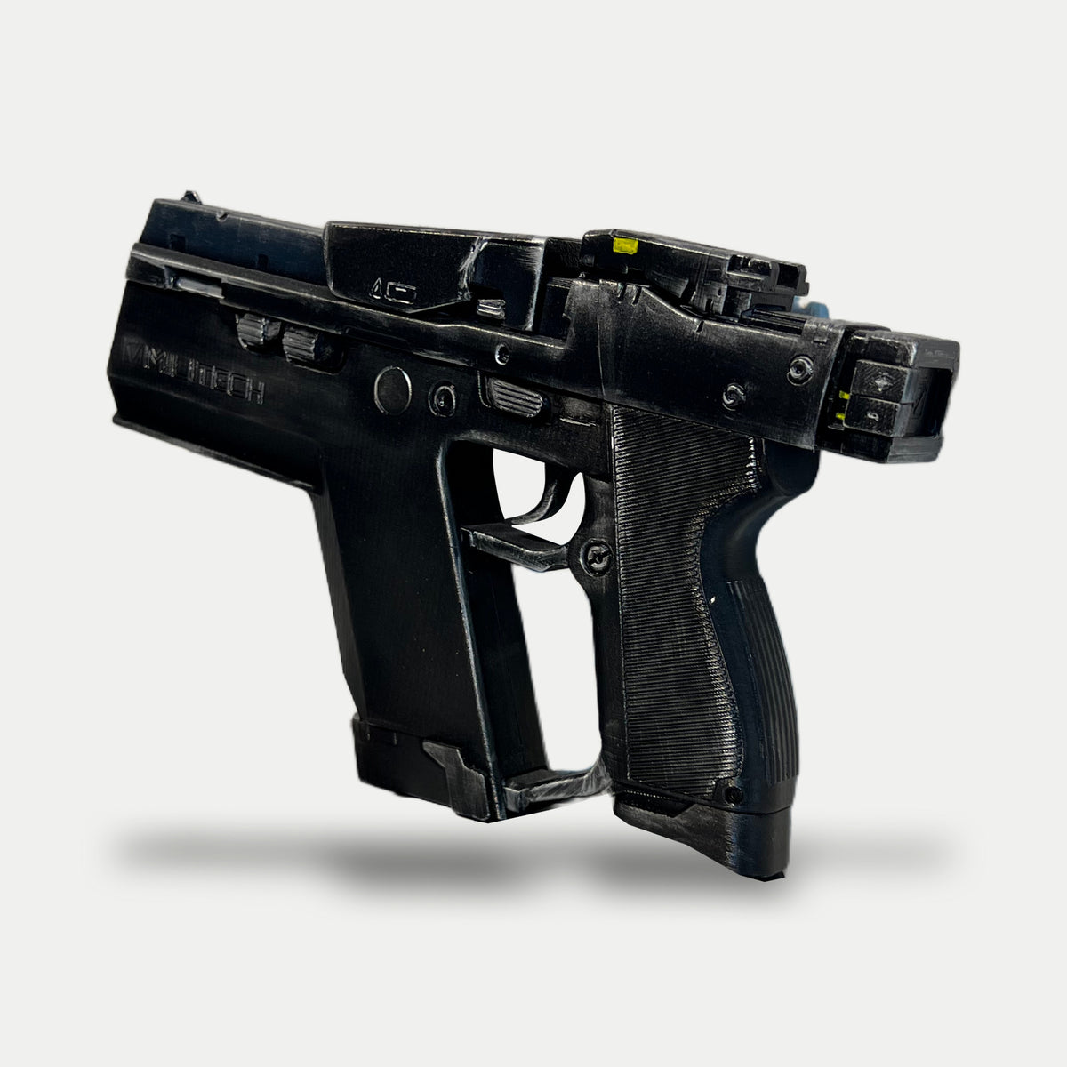 Angled view of the other side of the Cyberpunk Pariah pistol prop, showing the ribbed grip, silver-highlighted controls and yellow details on the upper sight block.