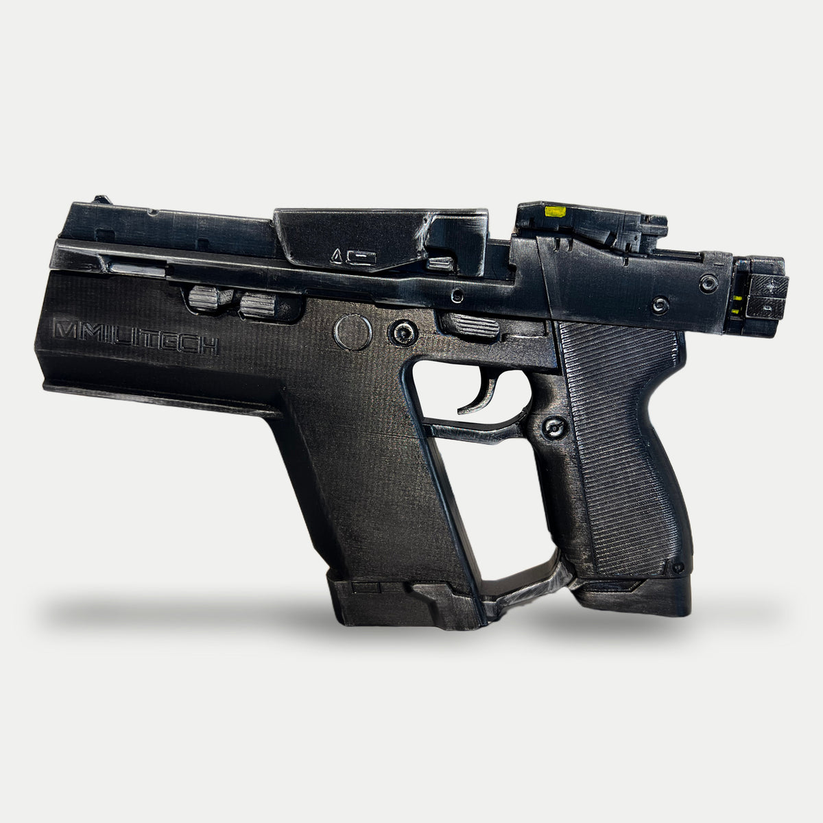 Opposite side of the painted Cyberpunk Pariah pistol prop, muzzle pointing left, showing slide controls, the ribbed grip and small yellow sight marks.