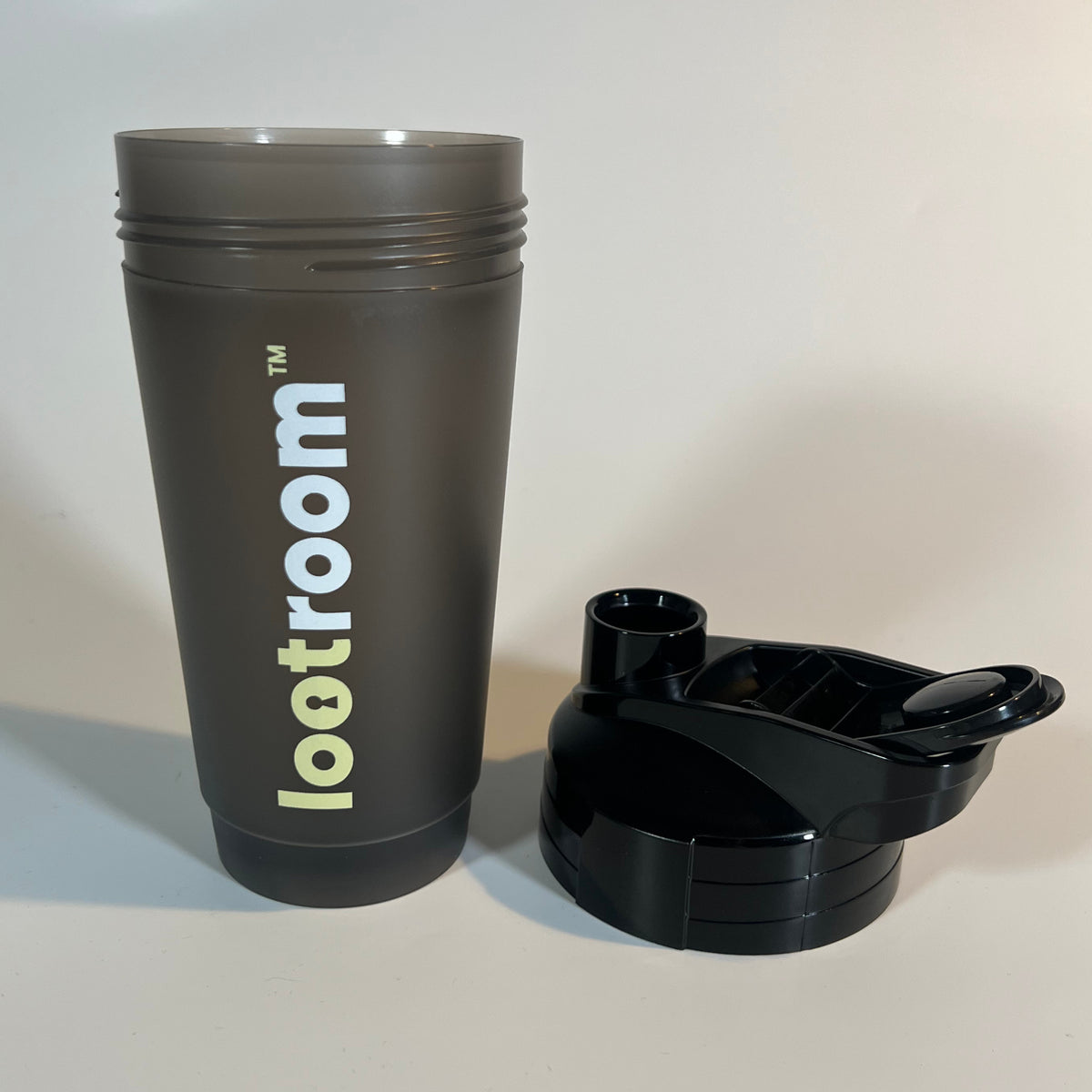 Lootroom Shaker opened, smoky cup and screw-on black lid side by side
