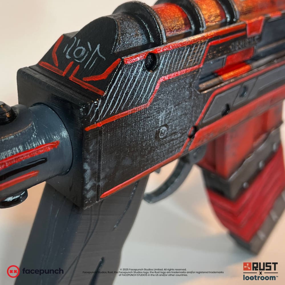 Detail of the Alien Red AK stock showing painted alien symbols and the orange heat glow along the edges