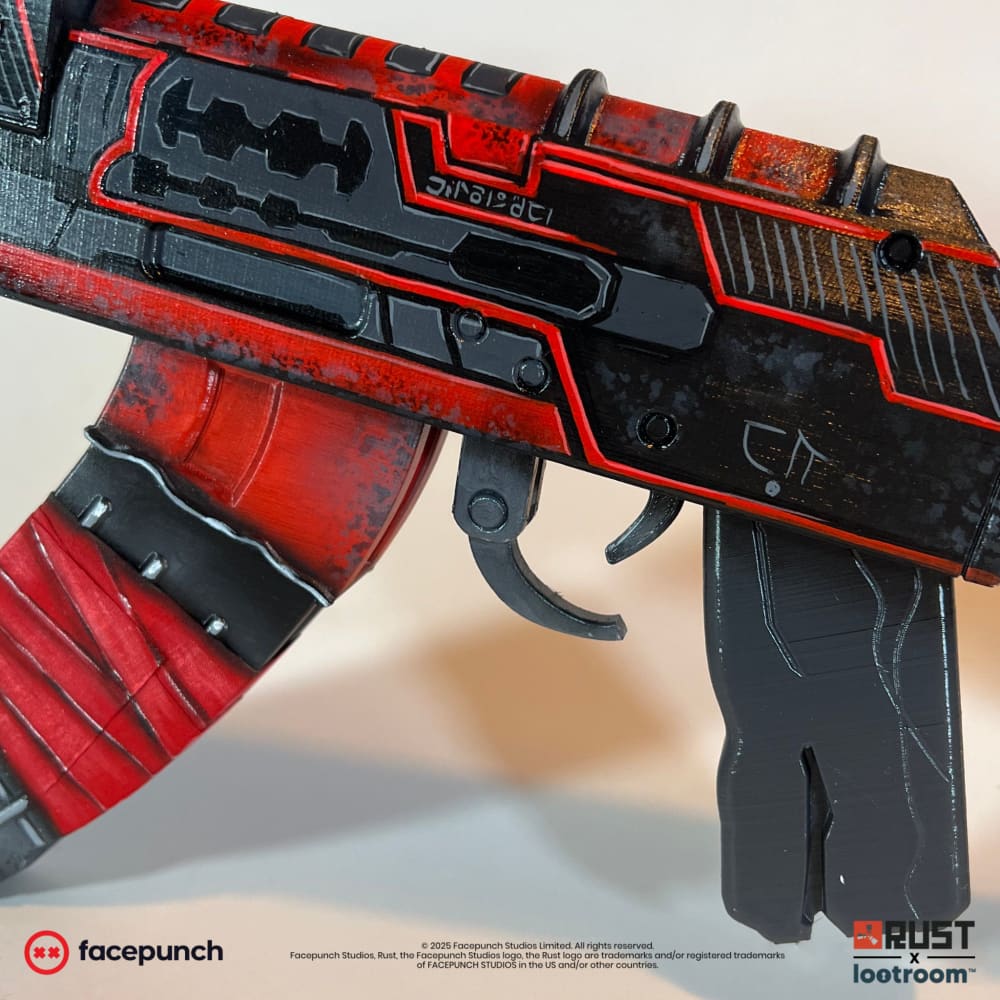 Rust Alien Red AK prop from the opposite side, 75cm with red panelling across the receiver and magazine