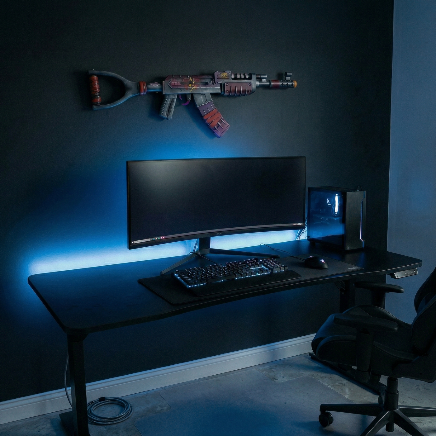 Rust Candy Hunter AK prop displayed in a gaming setup with blue backlight