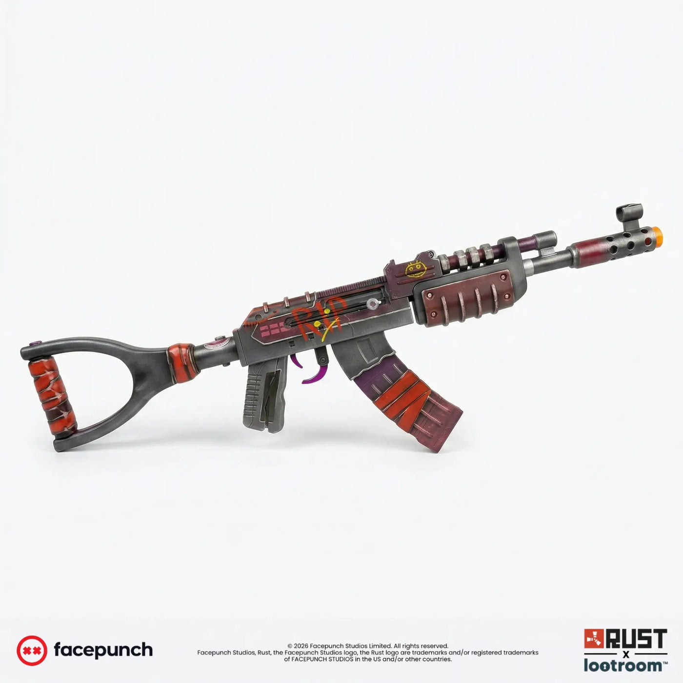 Rust Candy Hunter AK prop from the side, gunmetal body with deep red and purple panels