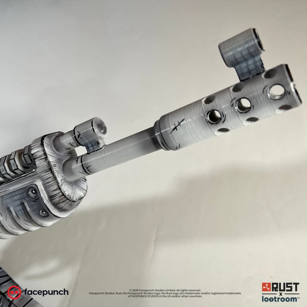 Close-up of the Comics AK muzzle brake and front sight, cross-hatching inked along the barrel.