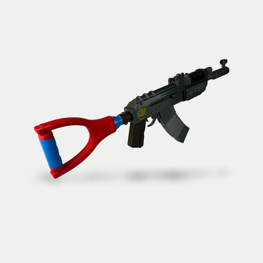 The darker Default AK prop at an angle from the stock end, with the yellow smiley sticker and the blue taped stock grip in front.