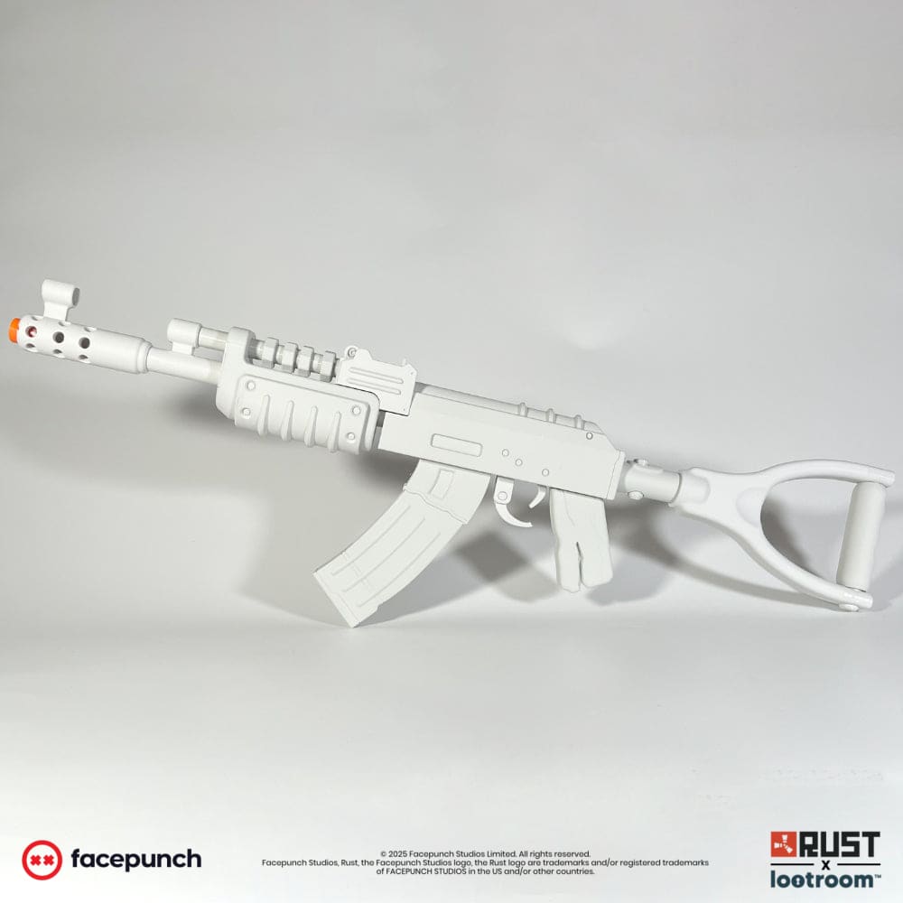 The unpainted light grey Rust AK DIY prop from the opposite side, showing the receiver and handguard.