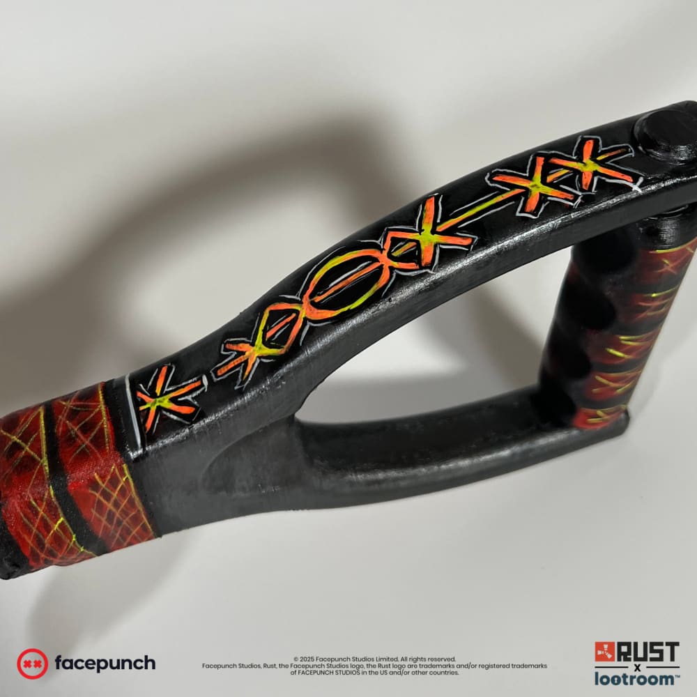 Close-up of the From Hell AK stock loop, hand-drawn glyphs running along its top edge.