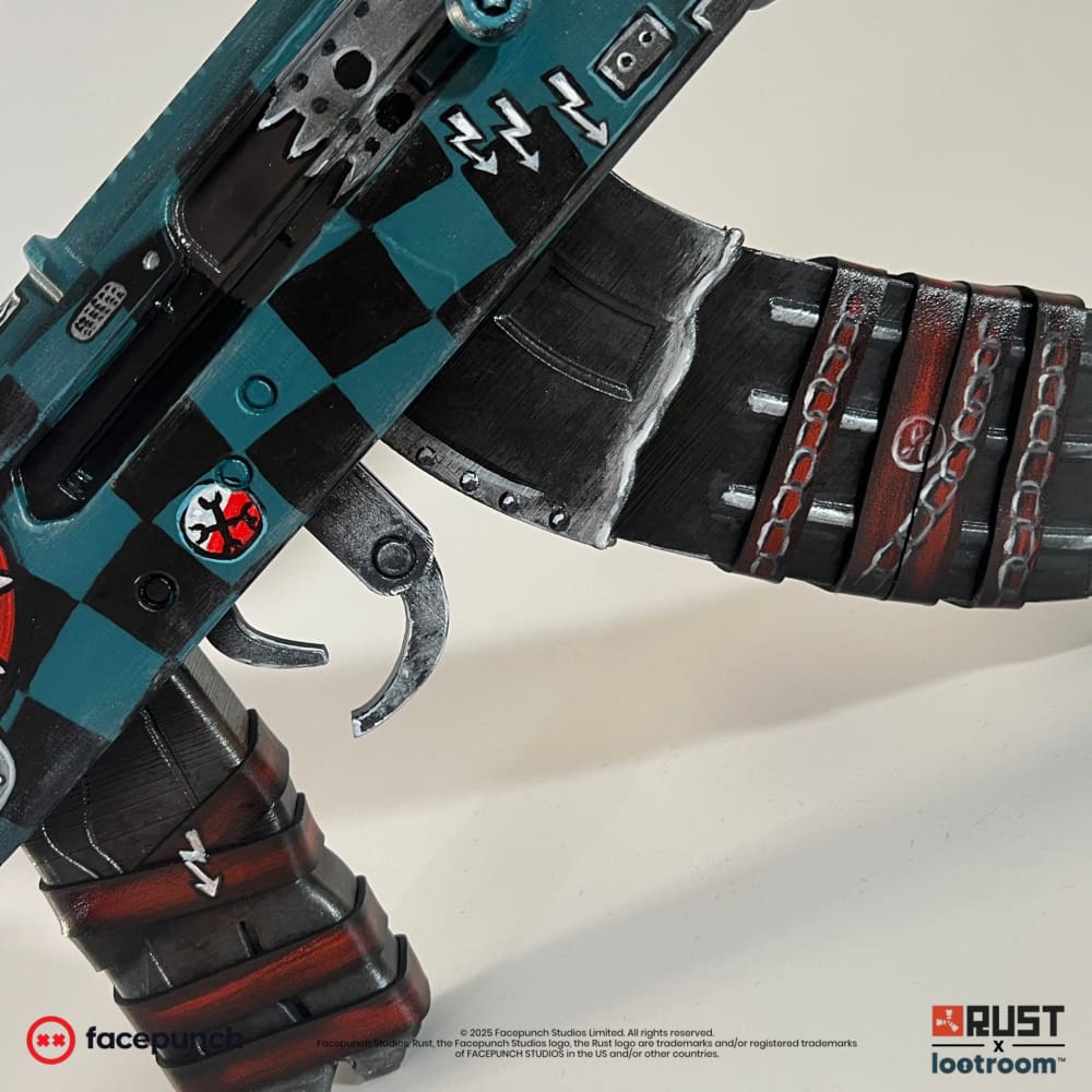 Close-up of the Gearlord AK receiver and magazine, chequerboard panels above painted chains.