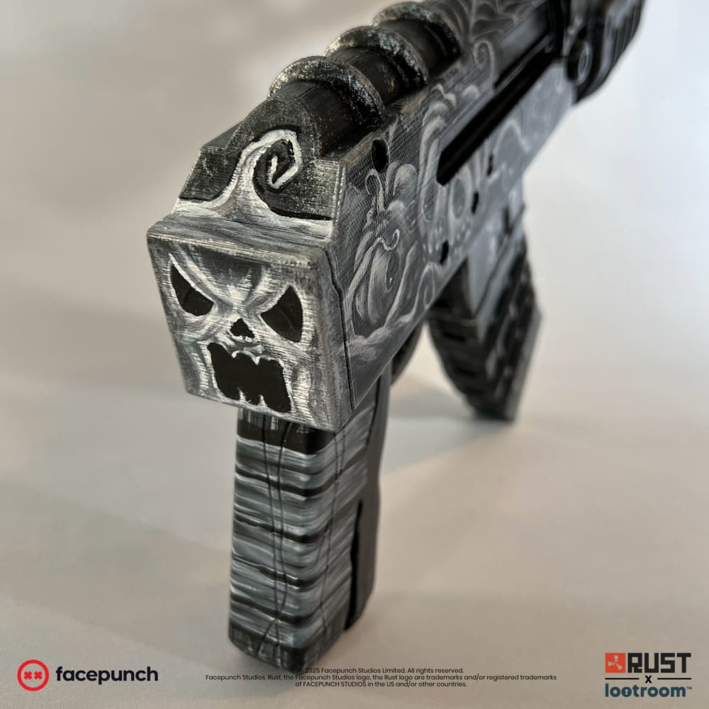 Close-up of the screaming face at the back of the Ghost Halloween AK, hollow eyes over black.