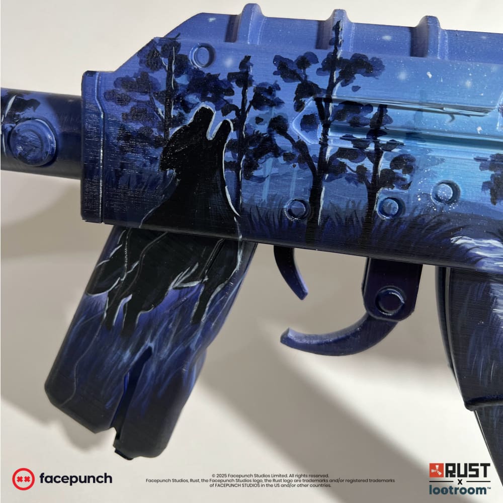 Close-up of the howling wolf on the isvolcano AK receiver, solid black against the blue.