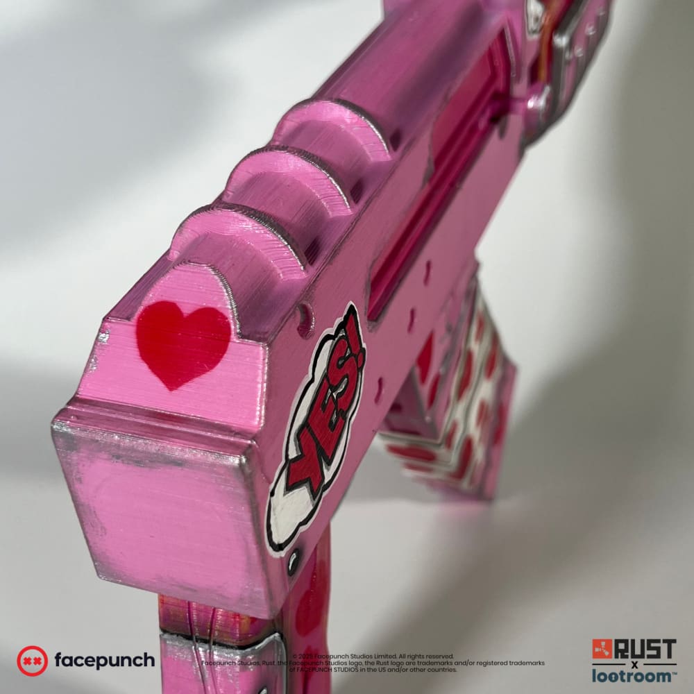 Detail of the Rust Kiss AK rear end where the stock is left off, with a red heart on the end cap