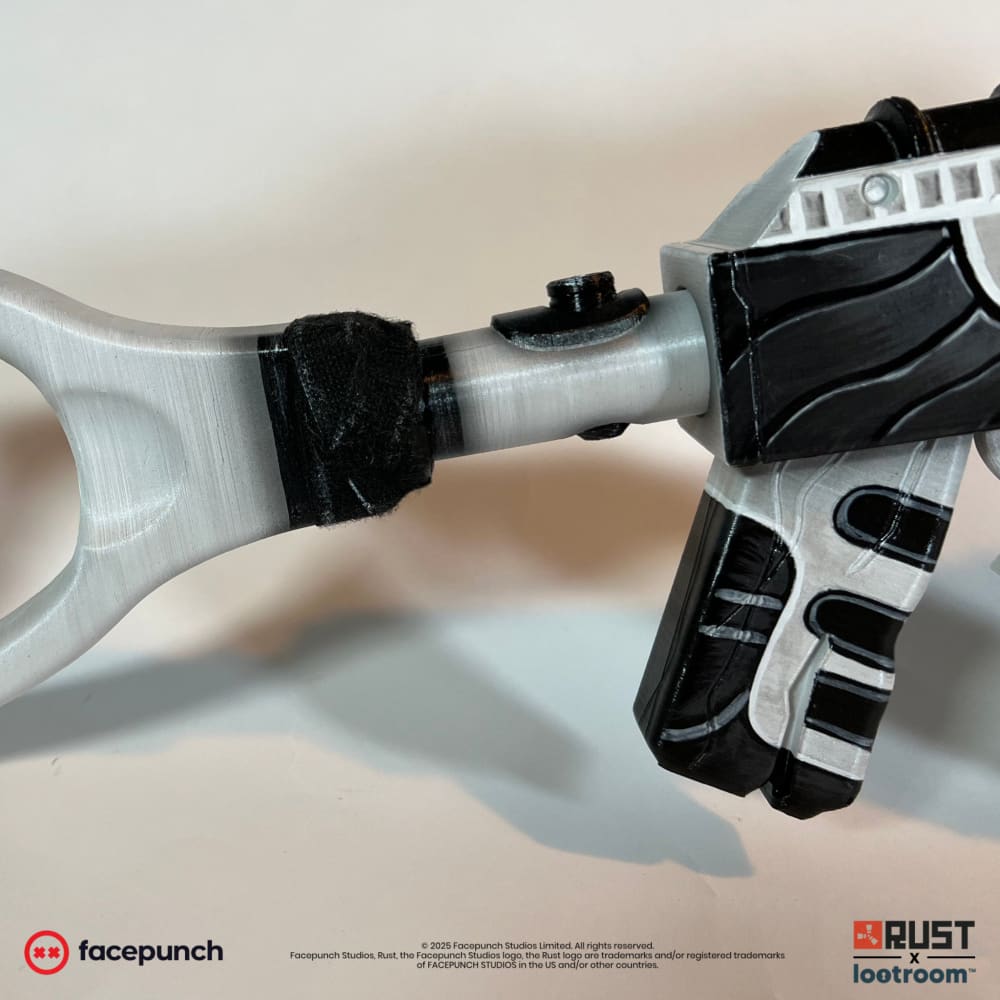 Close-up of the No Mercy AK stock neck, real black tape wrapped around the silver frame.