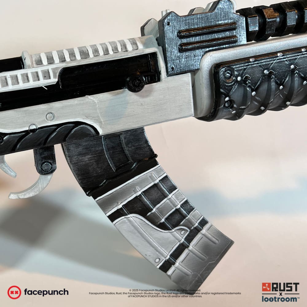 Close-up of the No Mercy AK receiver and magazine, light and dark plates alternating.