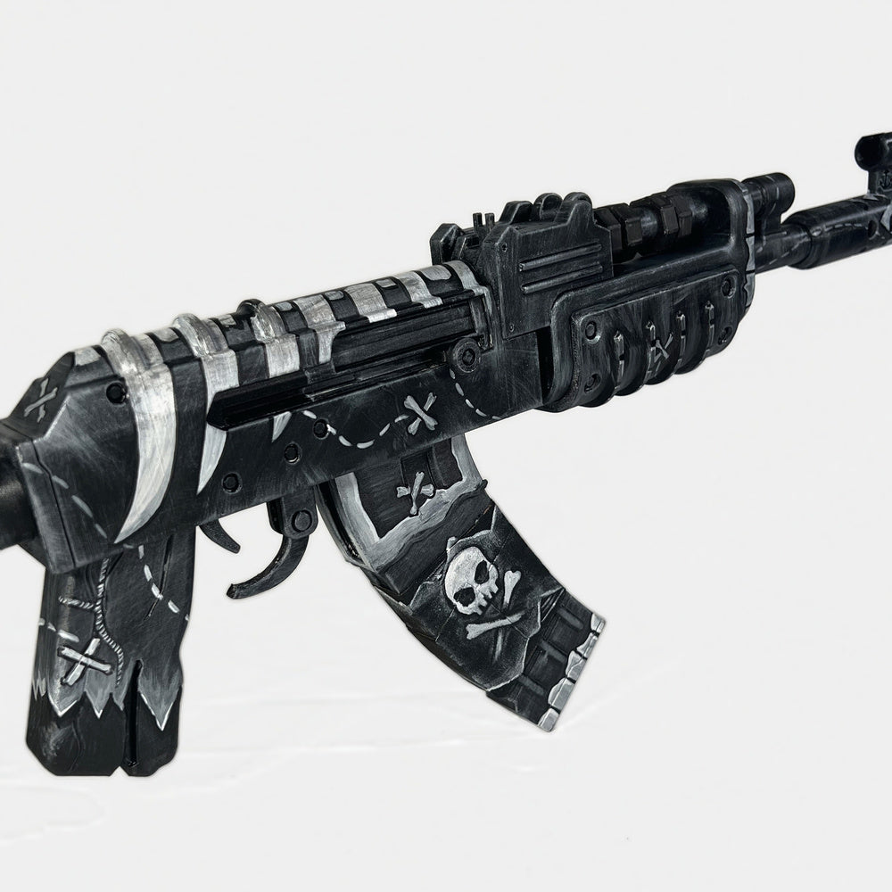 The Pirat AK prop at an angle, showing the skull on the magazine and the crosses on the grip.