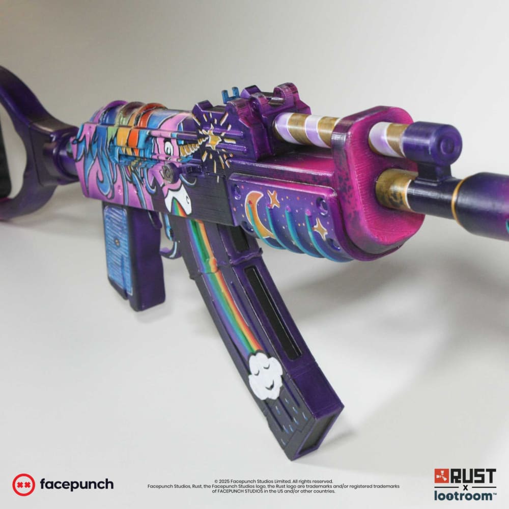 Rust Rainbow Pony AK prop at an angle, with the starburst and the crescent moon on the handguard
