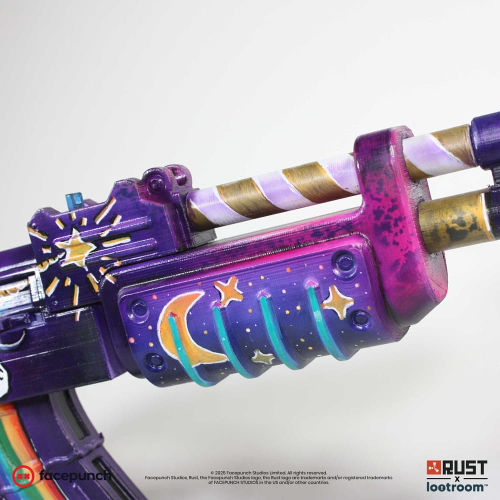 Handguard of the Rust Rainbow Pony AK painted as a night sky, next to the gold and white spiral barrel