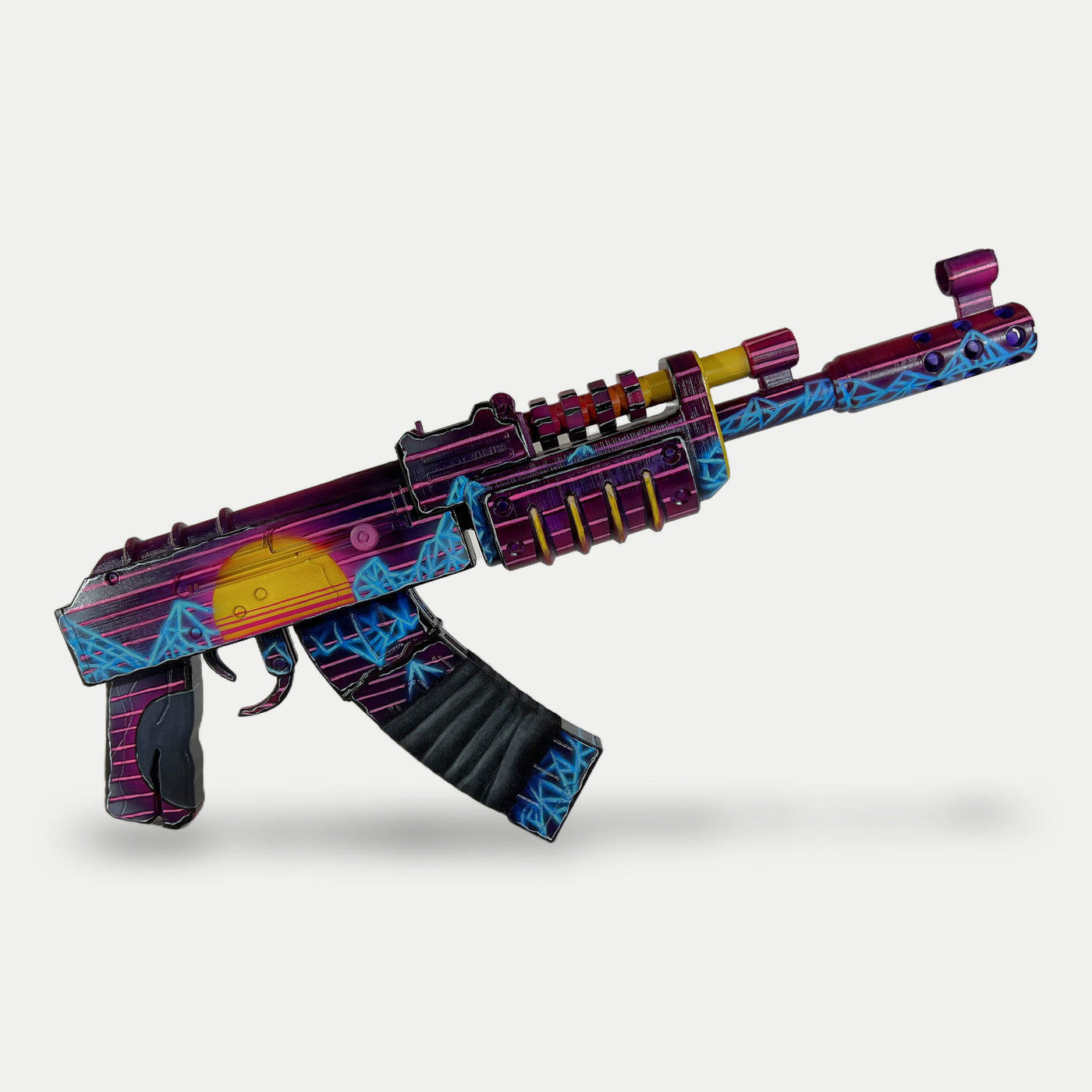 Close-up of the Retrowave AK muzzle brake, cyan wireframe mountains over deep purple.