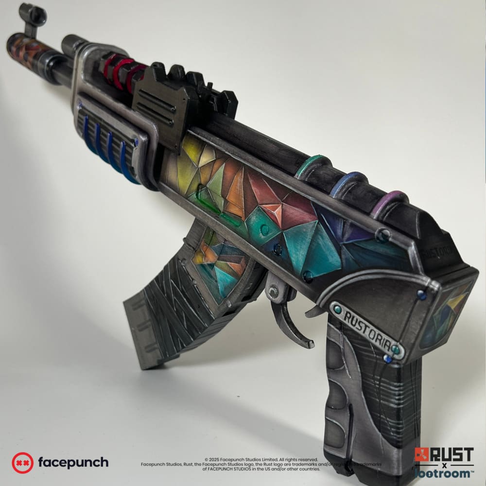 Rust Rustoria AK prop at an angle, the RUSTORIA name painted on the side plate above the grip.