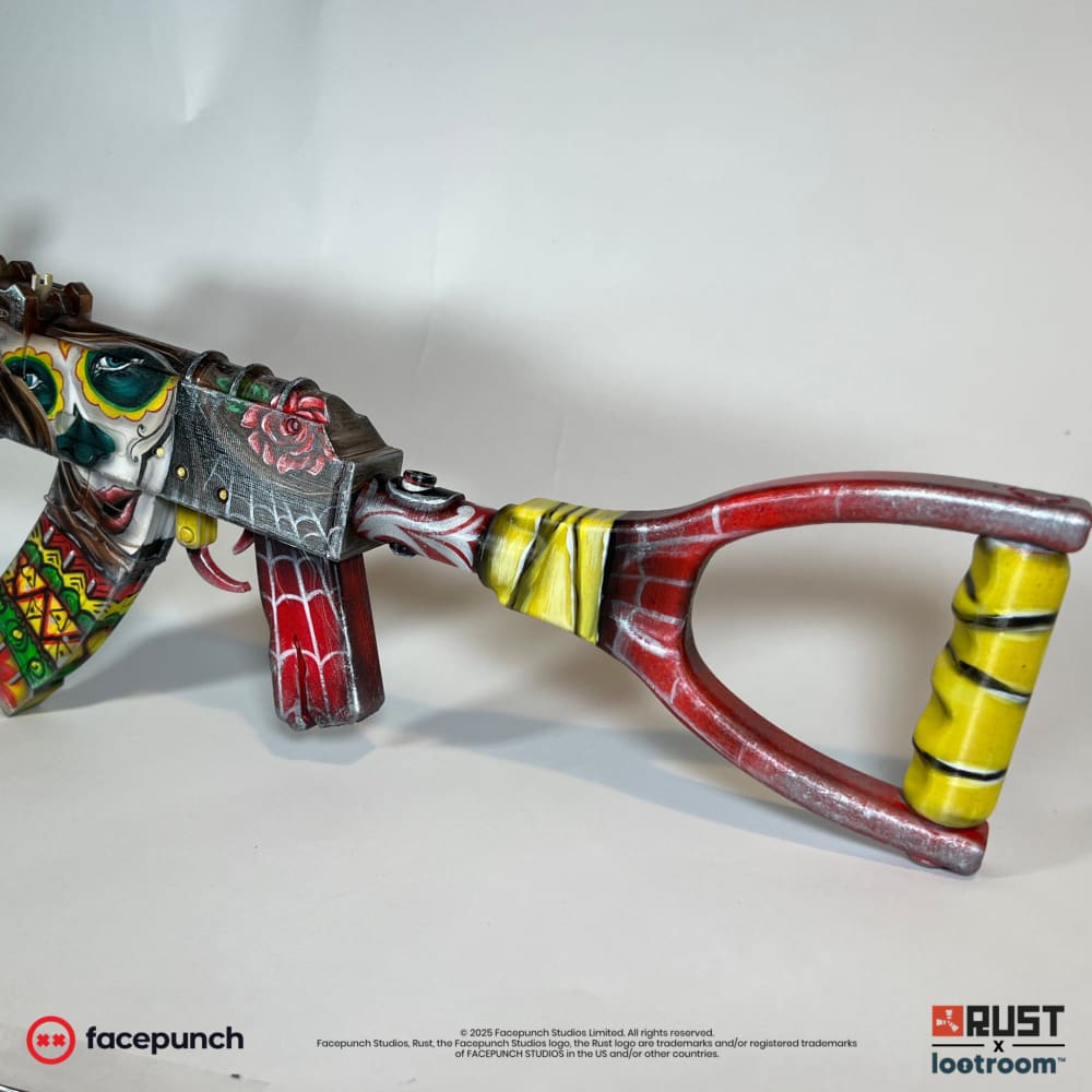 Rust Santa Muerte AK prop from the rear, red roses on the receiver cover and the yellow-banded stock.