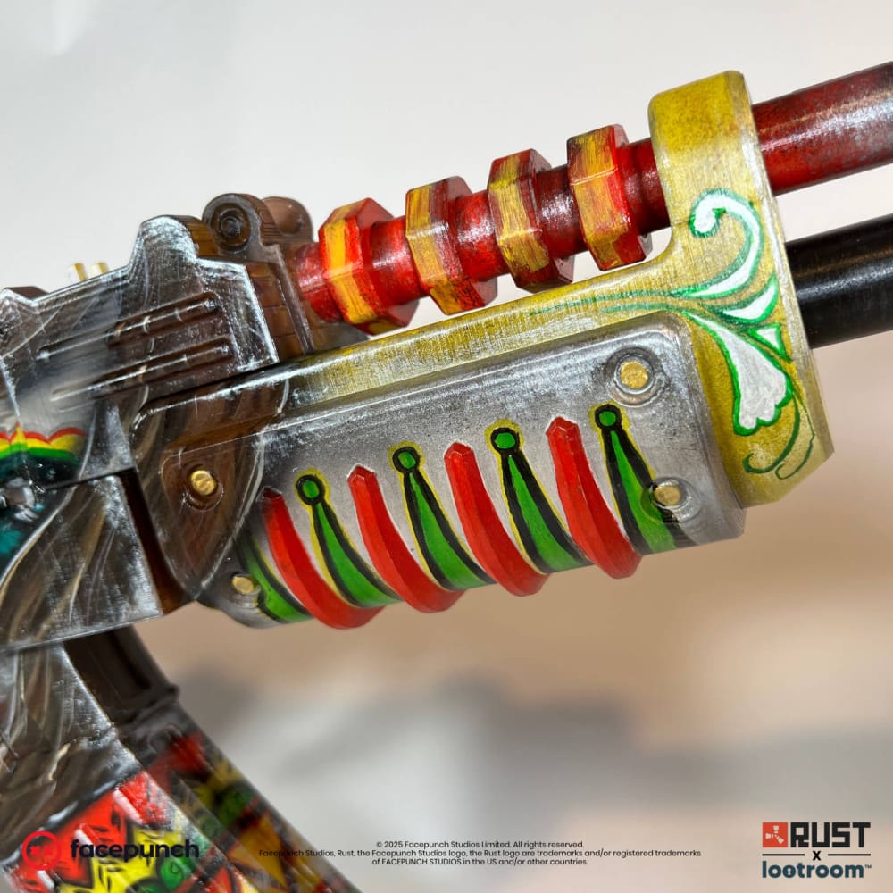 Close-up of the Santa Muerte AK handguard, red ribs with green at the base under a yellow collar.