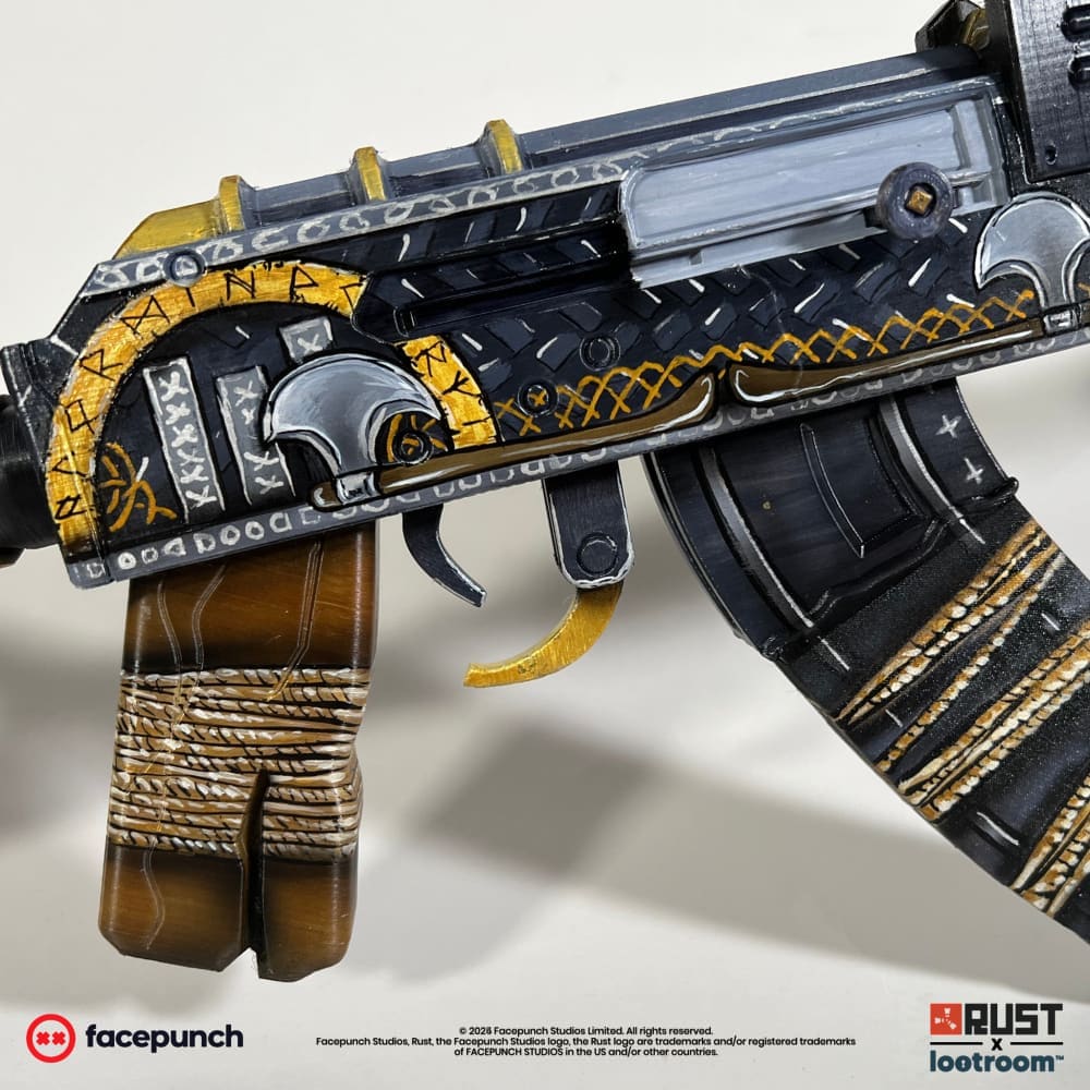 Close-up of the Ser Winter AK receiver, gold runes and a silver helmet with a nose guard.
