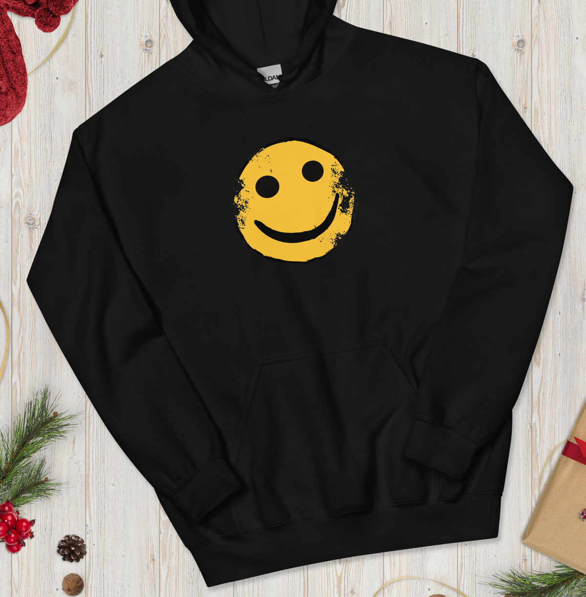 Rust AK Smiley unisex hoodie in black with a large yellow smiley print