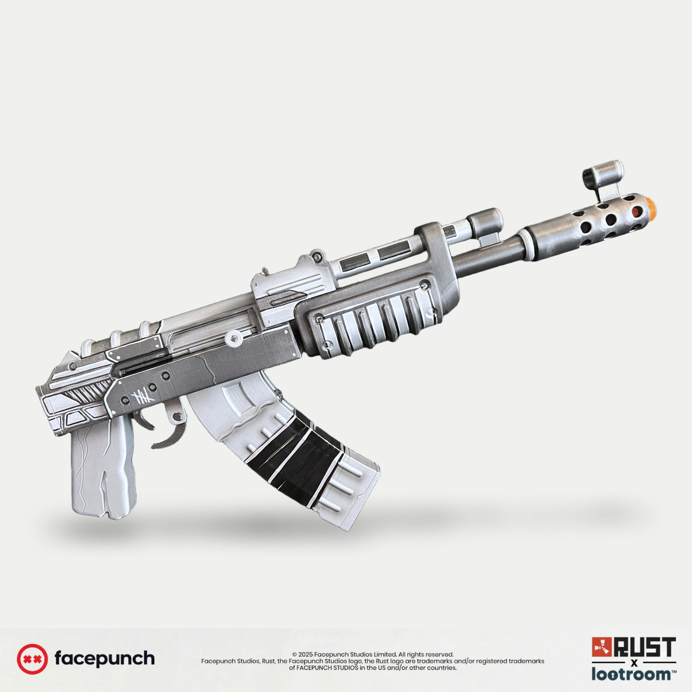 Rust Spinky AK prop from the side, brushed silver-white over black with the spinky. wordmark on the taped magazine