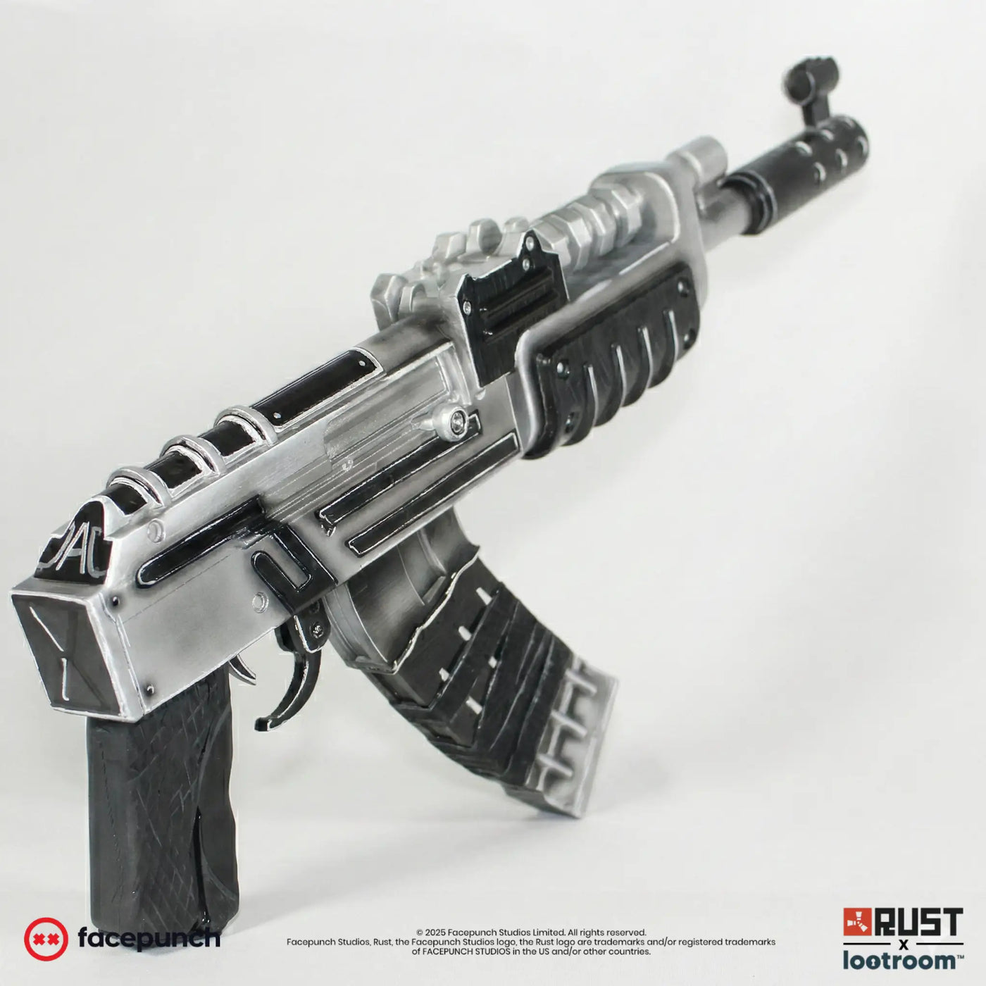 Rust Tacularr AK prop at an angle, TAC lettering painted on the receiver