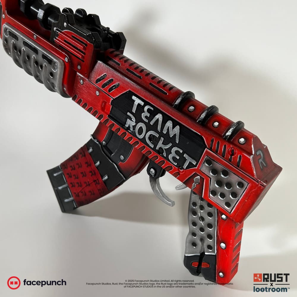 Rust Team Rocket AK prop from above, lettering on the receiver and R's on the magazine.