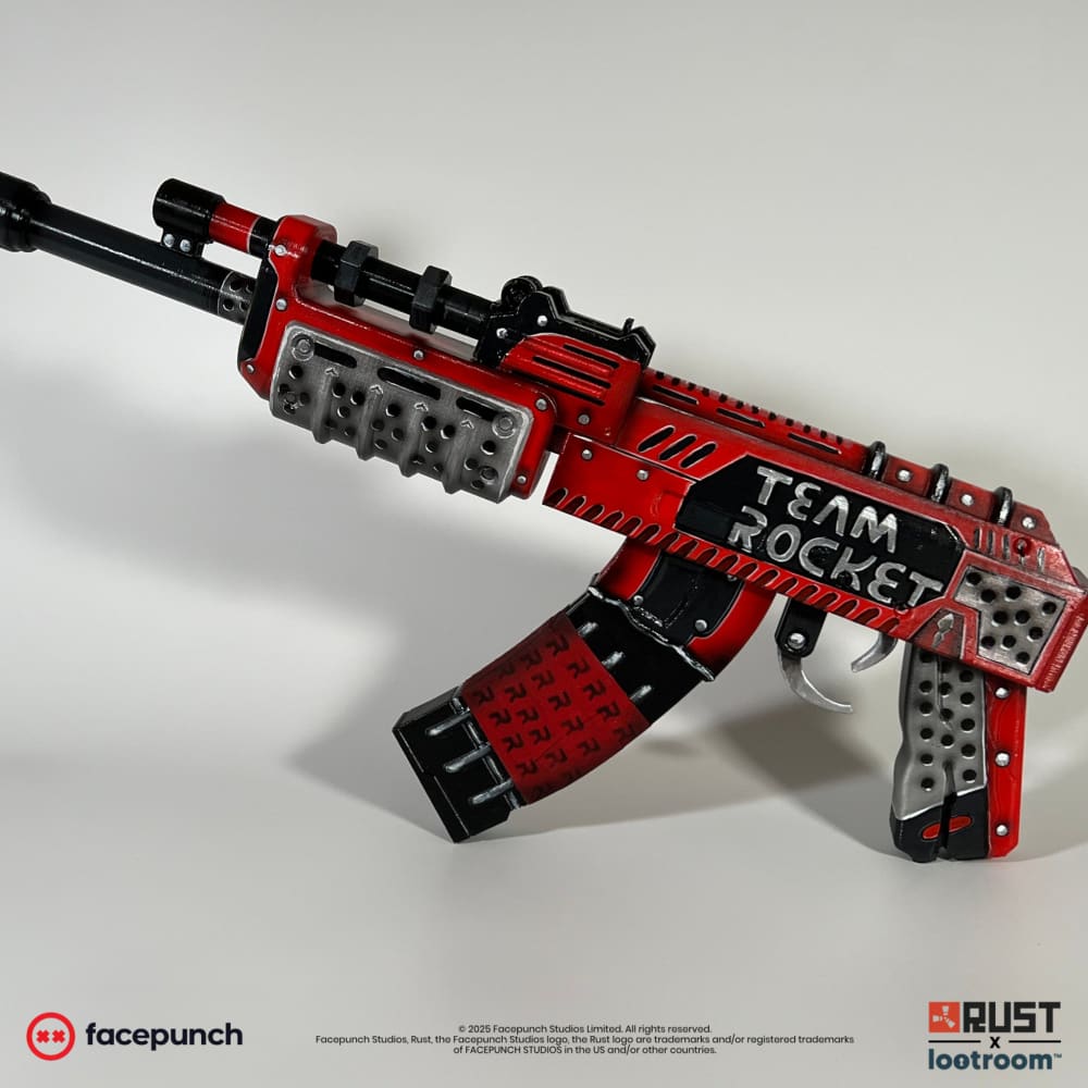 Rust Team Rocket AK prop seen from the front at an angle, red body with steel plates.