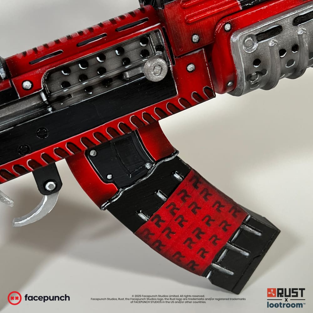 Close-up of the Team Rocket AK magazine, a grid of red R's on black.