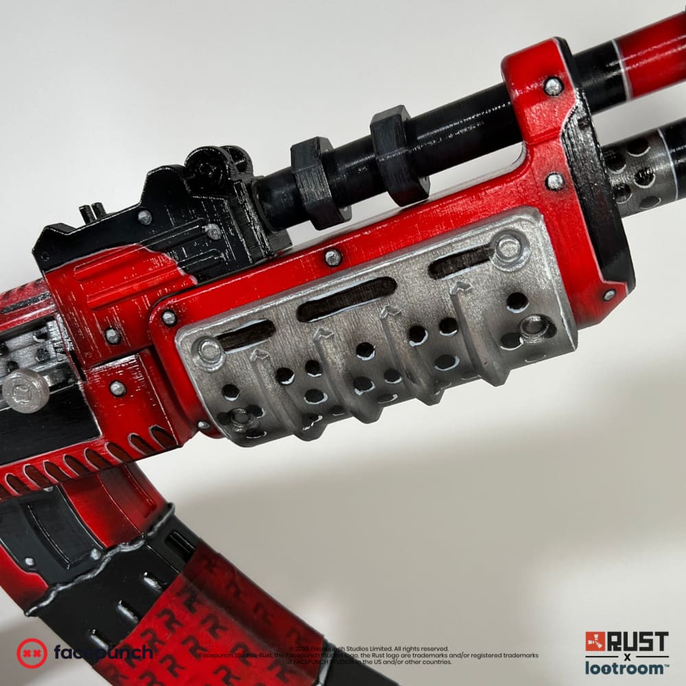 Close-up of the Team Rocket AK handguard, punched steel plate over red panels.