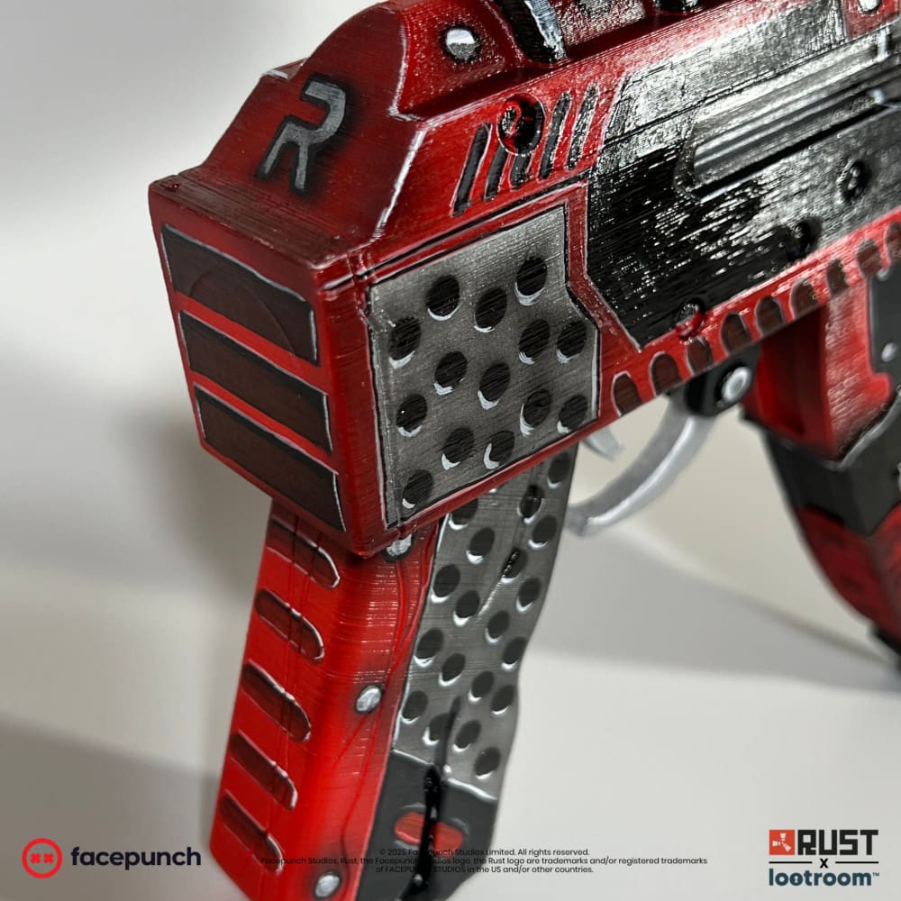 Close-up of the large silver R at the back of the Team Rocket AK receiver.