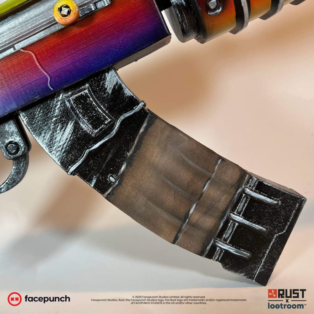 Close-up of the Tempered AK magazine in dark gunmetal below the coloured receiver.