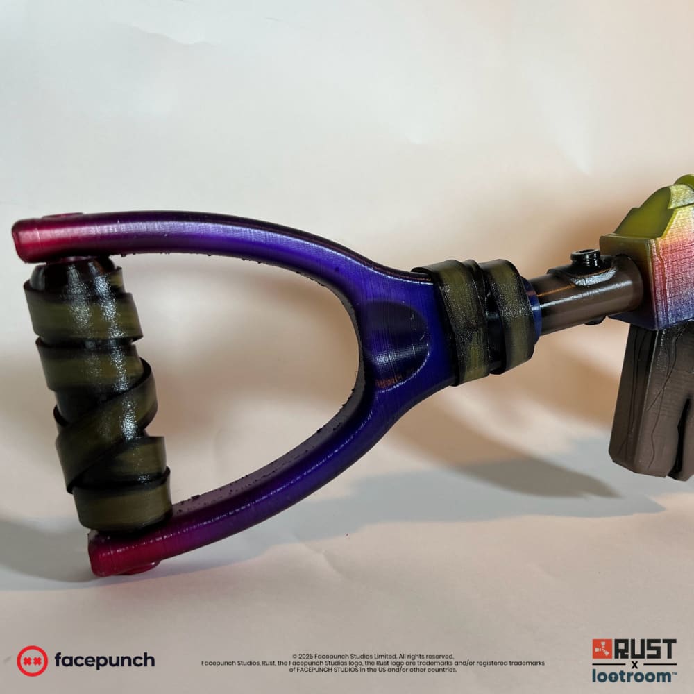 Close-up of the Tempered AK stock loop in magenta and violet, with painted tape at the grip.