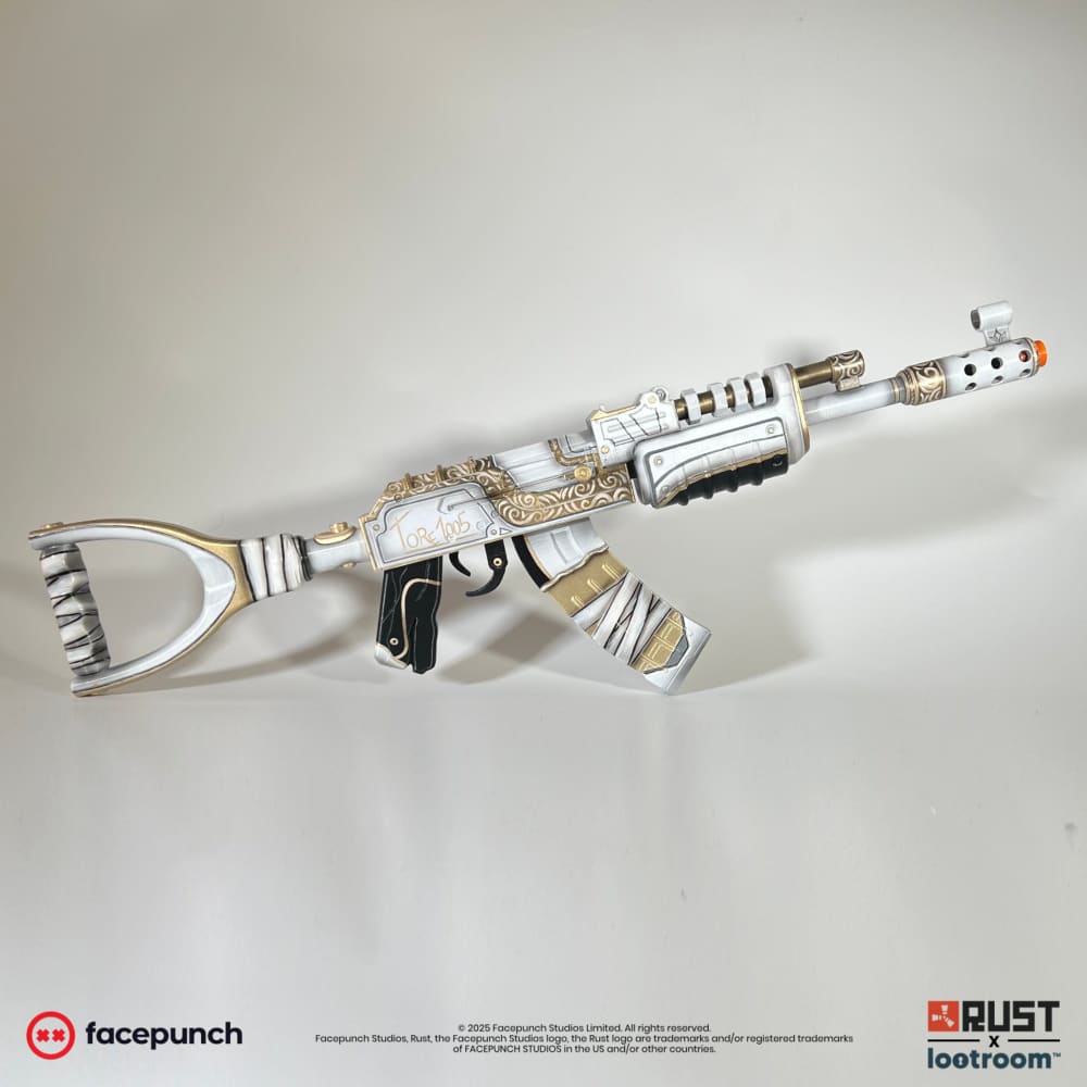 Rust Tore1005 AK prop, full side view of the white 75cm build with gold scrollwork.