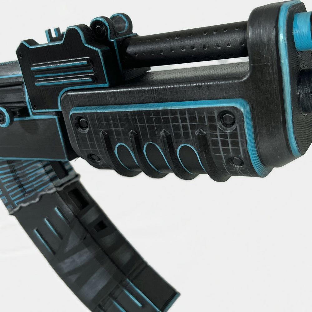 Close-up of the xQc AK handguard, cyan outlines around the slots and the gas tube rings.