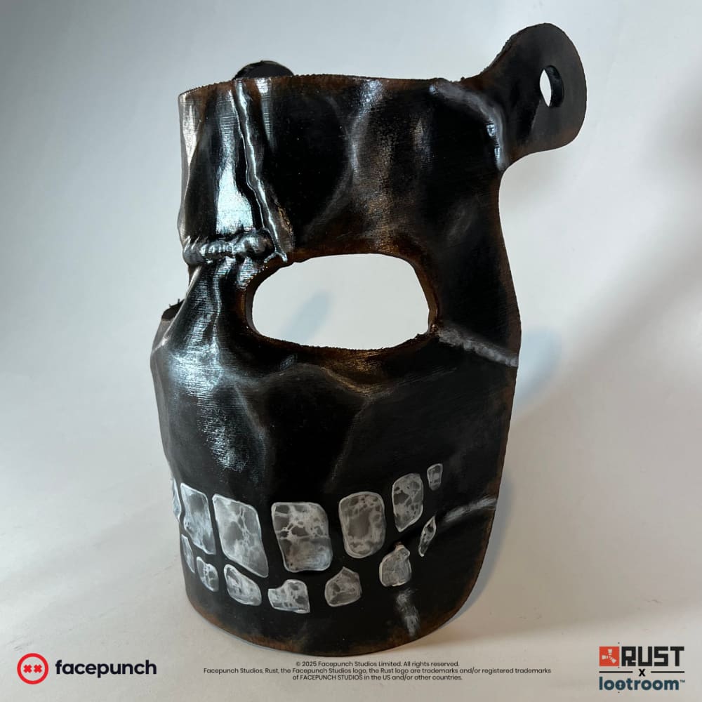 Rust Big Grin facemask from the right, showing the raised welded seam running over the brow