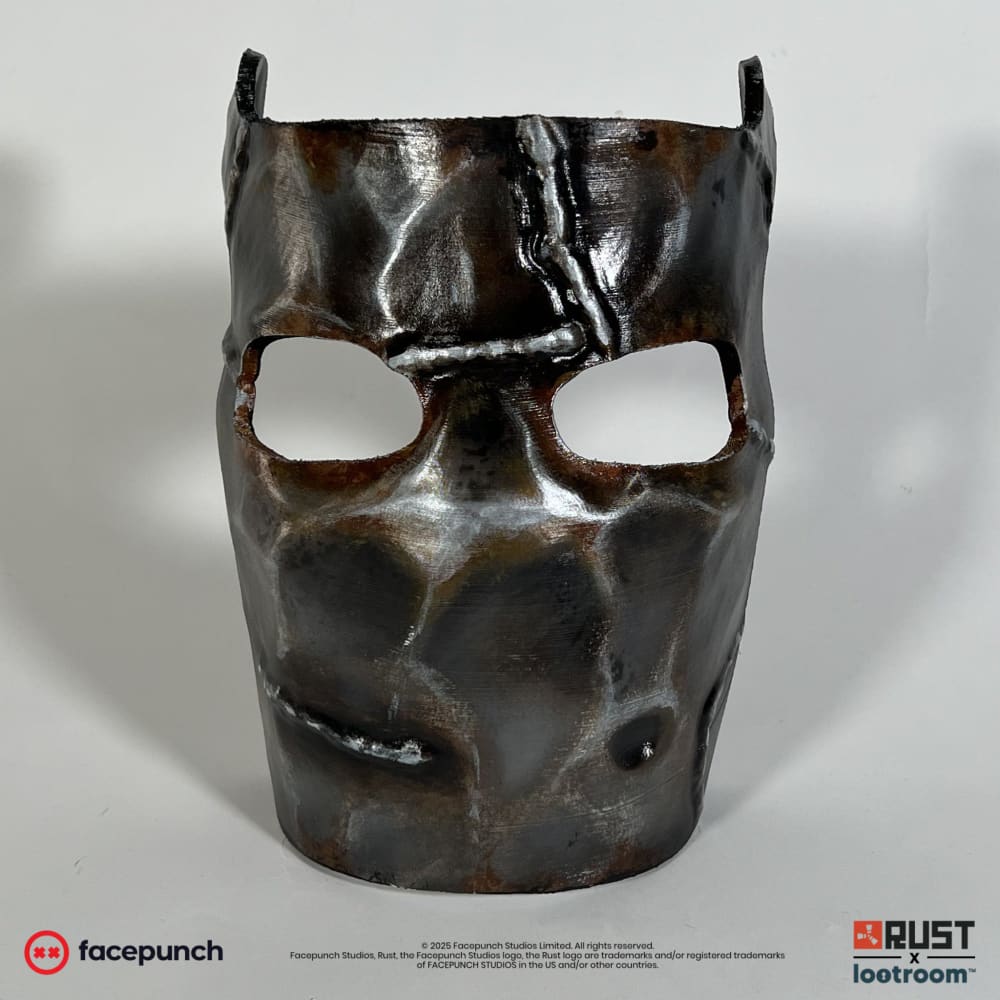Rust Metal Facemask prop from the front, rust-brown weathering with the two eye openings