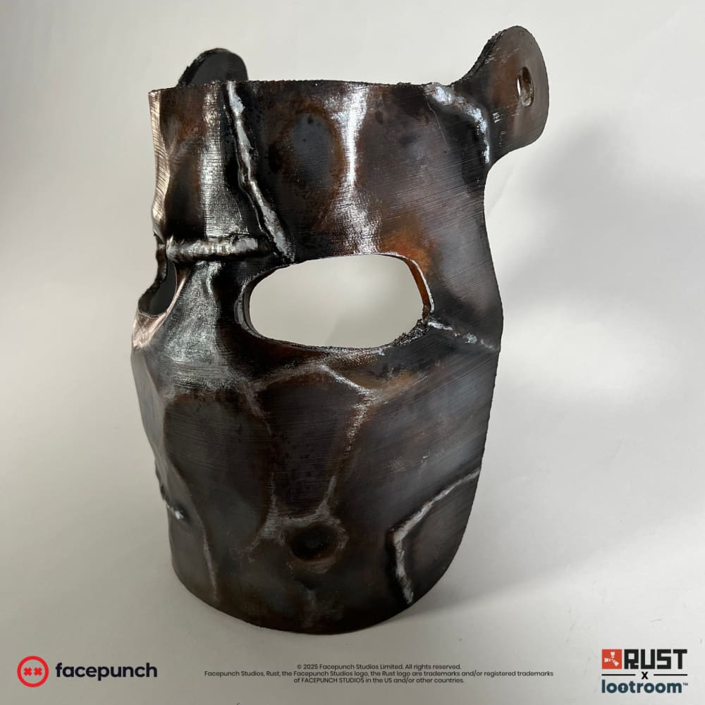 Rust Metal Facemask prop from the side, showing one of the two pre-drilled holes for the strap
