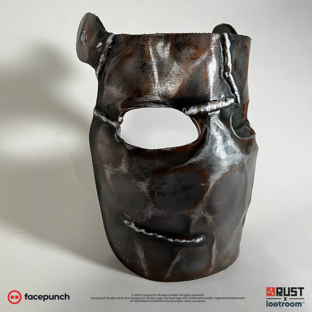 Rust Metal Facemask prop from the other side with the second pre-drilled hole and the dented shell