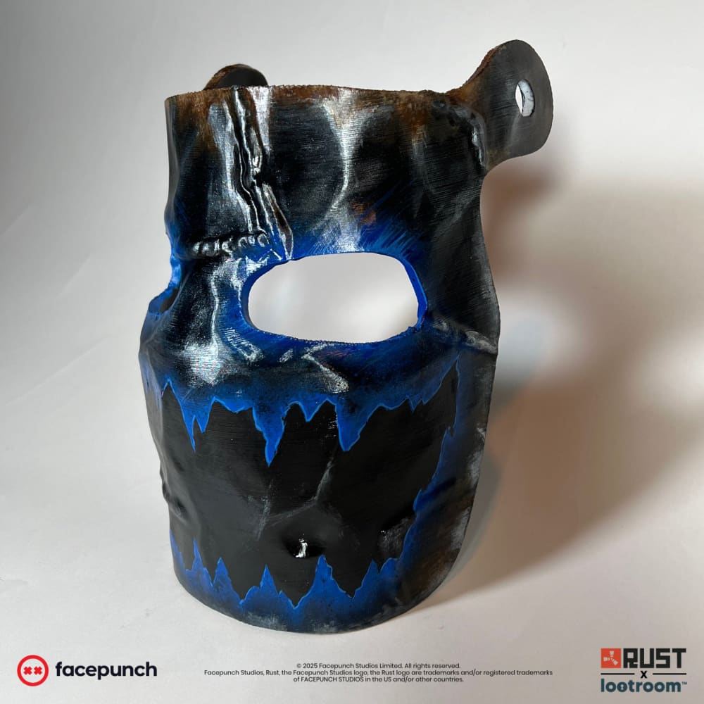 Rust Frostbite facemask prop at an angle, one of the two pre-drilled holes visible at the top