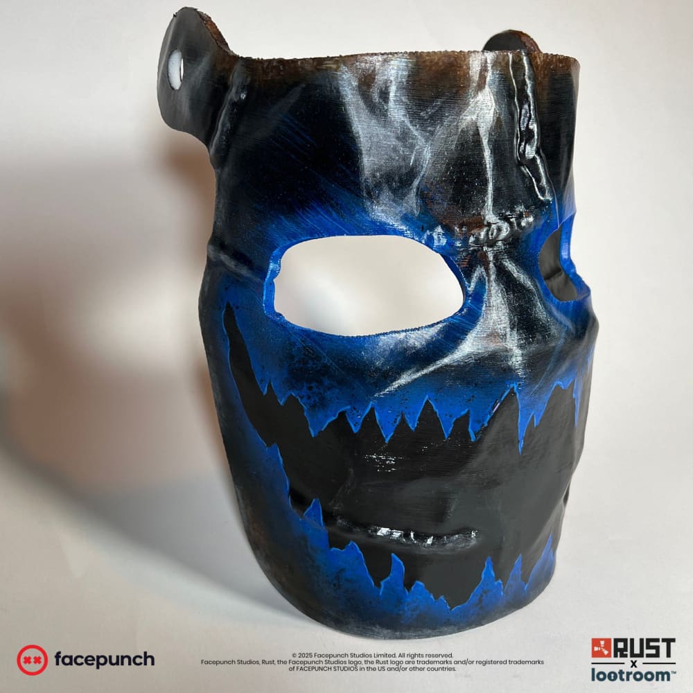 Rust Frostbite facemask prop at an angle from the other side, blue frost running along the mouth line