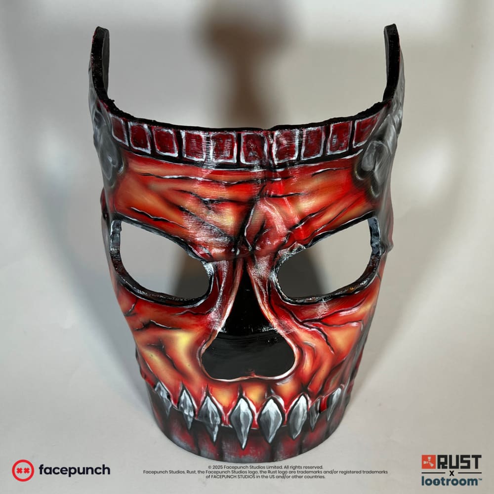 Rust Killjoys facemask prop, front view showing the dark red rivet band above the brow