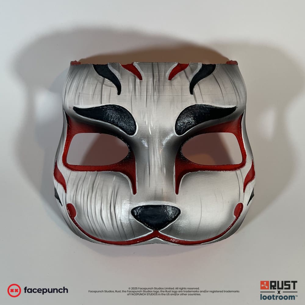 Rust Mendo kitsune facemask prop, front view of the silver-white fox face with red markings